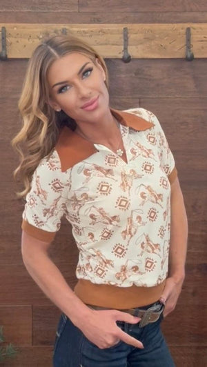 Woman wearing a patterned shirt with a blurred background