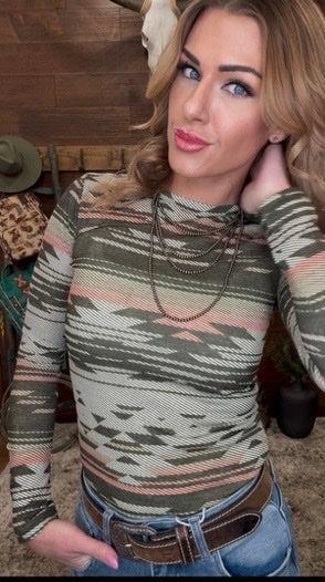 Woman wearing a patterned long sleeve top