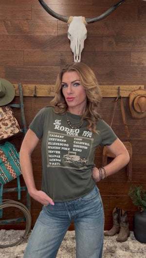 Woman wearing a t-shirt with 'The Rodeo 1998' design