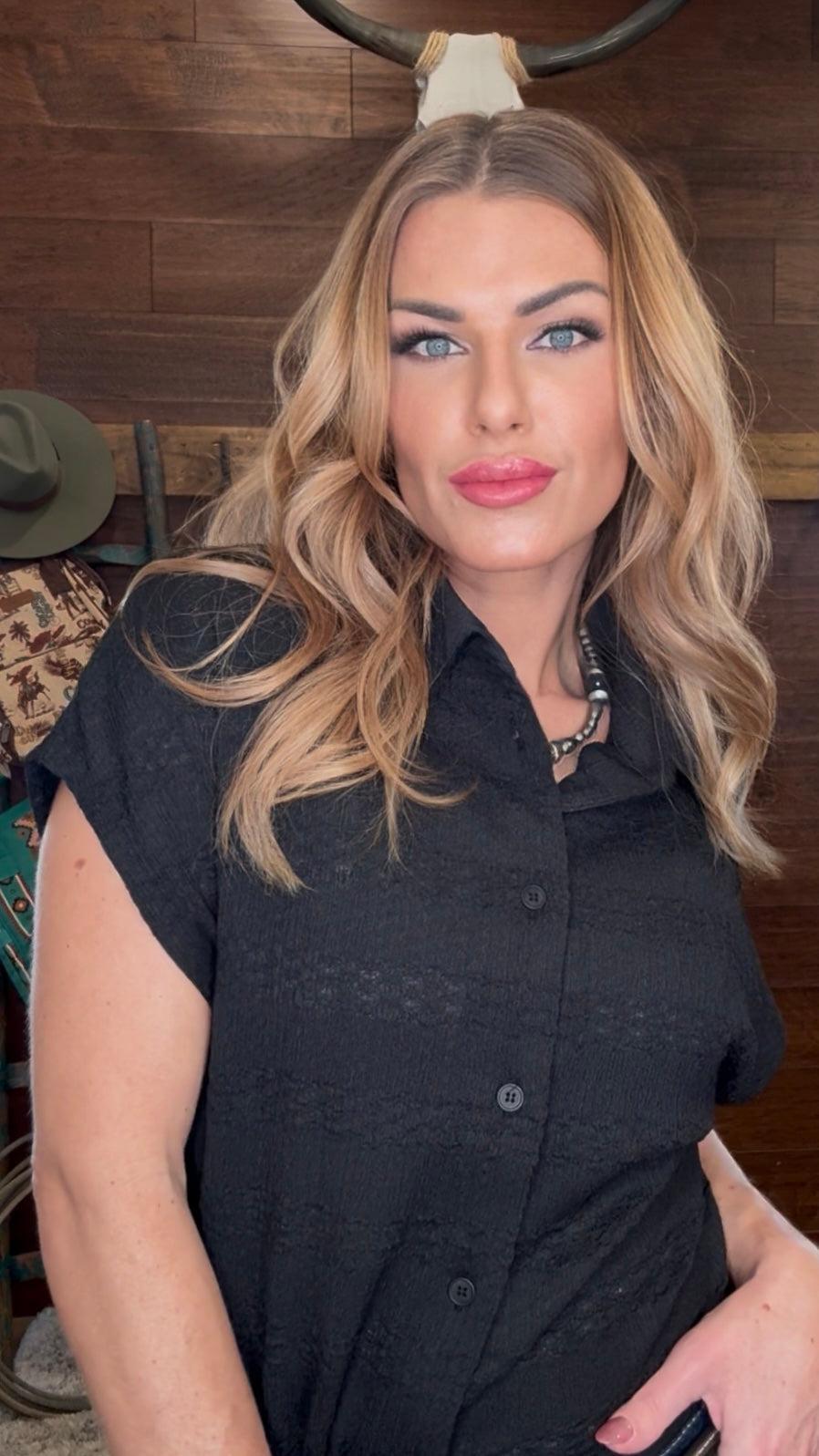 Woman wearing a black short-sleeve shirt