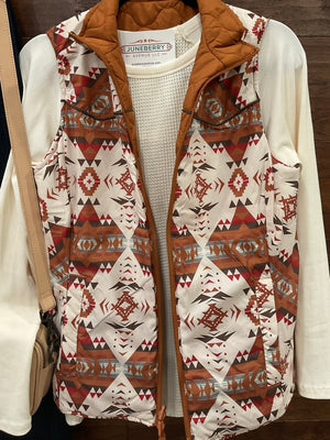 Reversible vest, featuring a striking Aztec print on one side and a solid camel finish on the reverse.