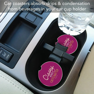Car coasters absorbing drips and condensation from a beverage in a cup holder.