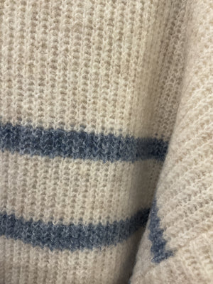 A cream and blue striped knit sweater