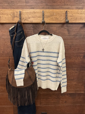 A cream and blue striped knit sweater