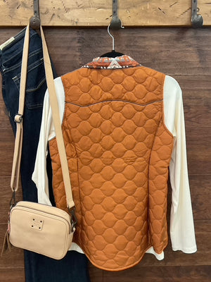 Reversible vest, featuring a striking Aztec print on one side and a solid camel finish on the reverse.