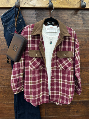 A burgundy and beige plaid flannel shirt with a brown corduroy collar and chest pockets