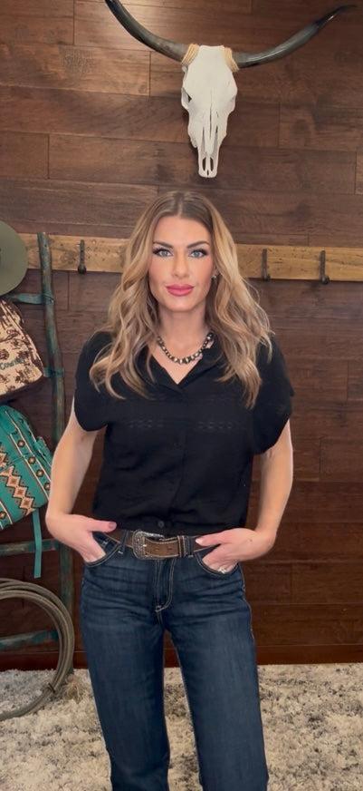 Woman wearing a black short-sleeve shirt