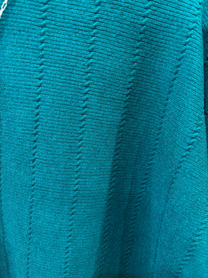 This sweater features a refined vertical texture, long dolman sleeves, and a classic boat neckline