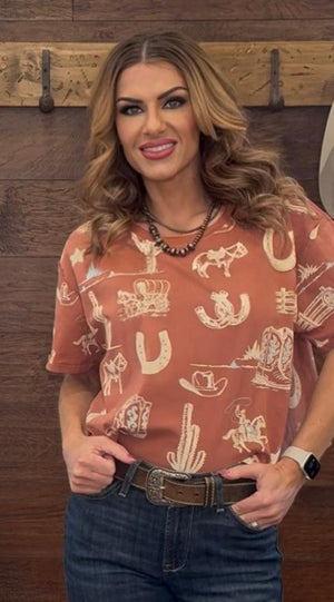 Woman wearing a patterned shirt with a wooden background