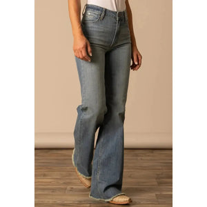 Person wearing blue flared jeans