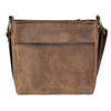 Brown leather bag with a visible brand logo worn by a person.