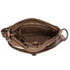 Brown leather bag with a visible brand logo worn by a person.