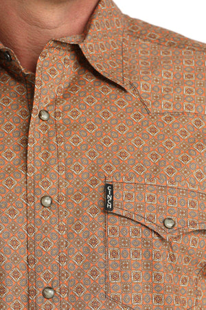 Close-up of a patterned shirt with a brand tag visible