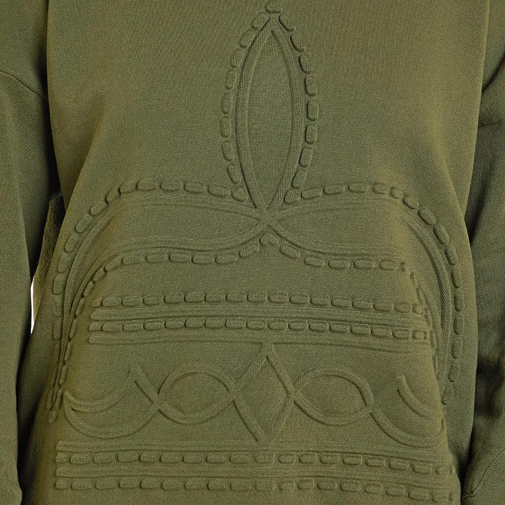 Close-up of a green garment with intricate patterns on the back