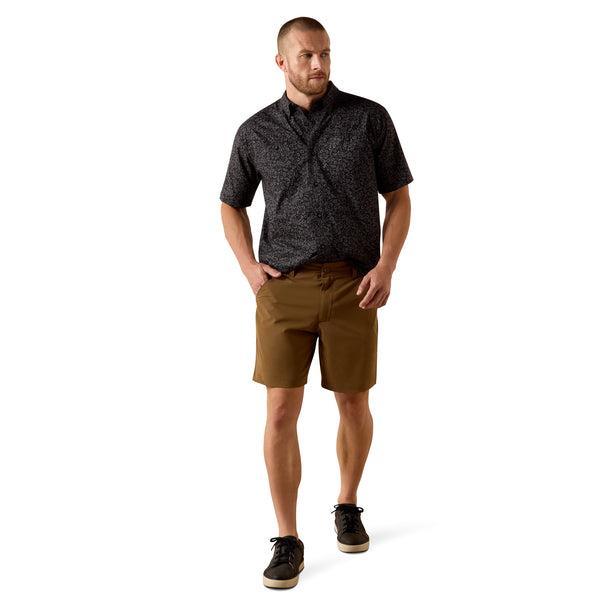 Man wearing a black patterned short-sleeve shirt