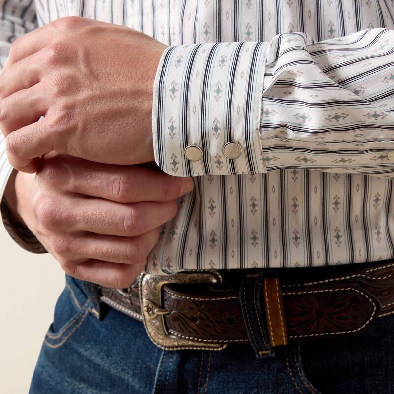 A man wearing a long-sleeve western-style button-down shirt with thin vertical blue and white stripes