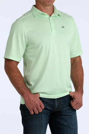 Light green polo shirt worn by a person on a white background