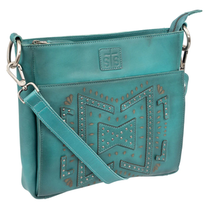 Teal handbag with decorative patterns and a visible brand logo on a white background
