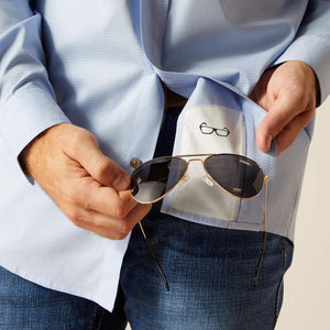 Man wearing a light blue button-up shirt