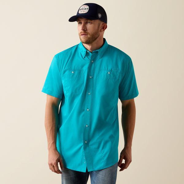 Man wearing a turquoise shirt