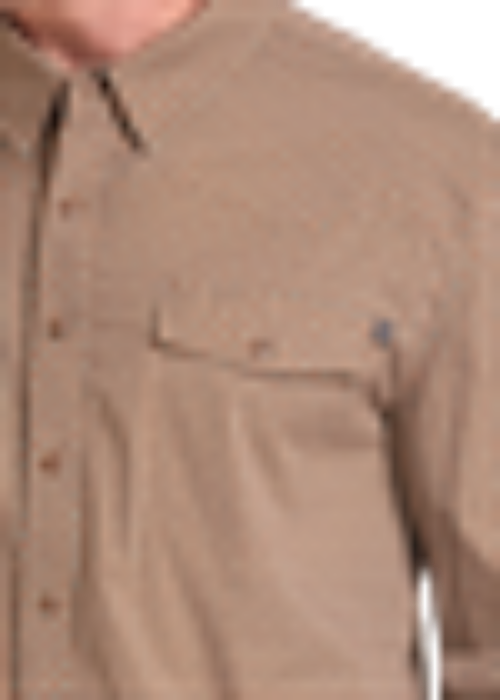 Close-up of a tan button-up shirt with a chest pocket, shown on a model.