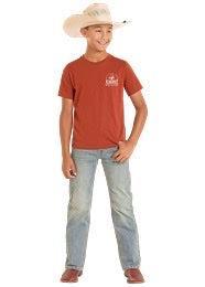 Child wearing a red t-shirt with a logo and light blue jeans on a white background