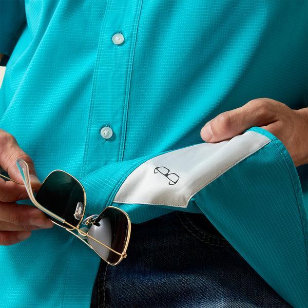 Man wearing a turquoise shirt