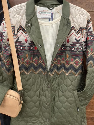 An olive green quilted jacket with a colorful geometric pattern across the chest and upper sleeves