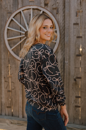 Women’s crew neck super soft shirt with western ropes on it.