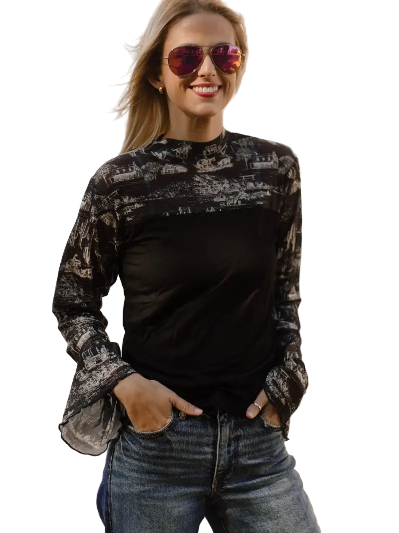 Woman wearing a black western patterned shirt