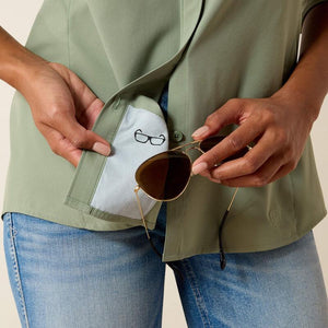 Person holding sunglasses with a shirt pocket featuring sunglasses icon