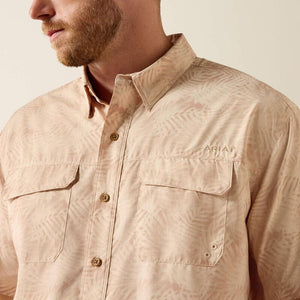Short sleeve button down beige patterned shirt.