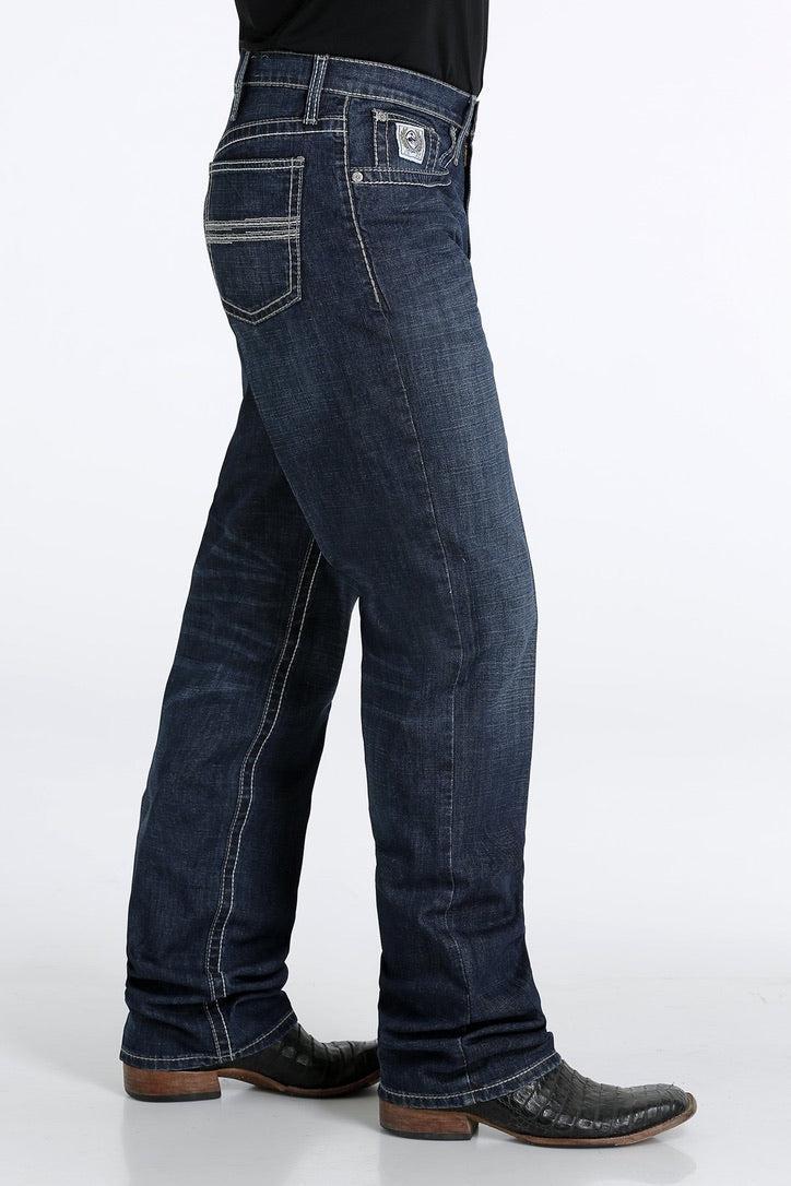 Blue jeans worn by a person on a white background