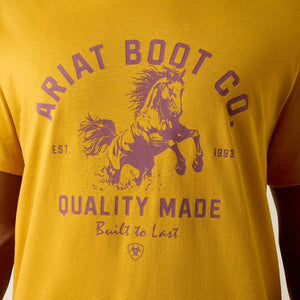 Yellow t-shirt with purple 'Ariat Boot Co.' logo and text on a yellow background