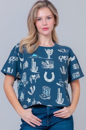 Woman wearing a blue t-shirt with white graphic designs