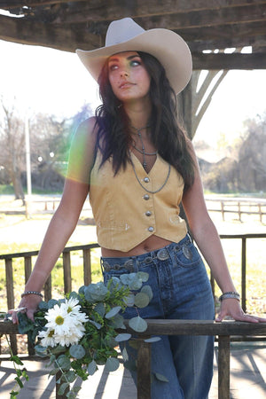 Woman wearing a gold vest