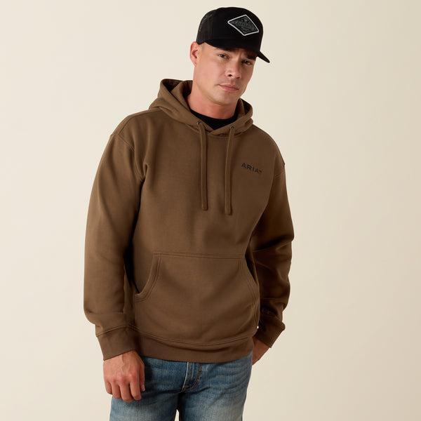 A man wearing a brown pullover hoodie with a drawstring hood and kangaroo pocket.