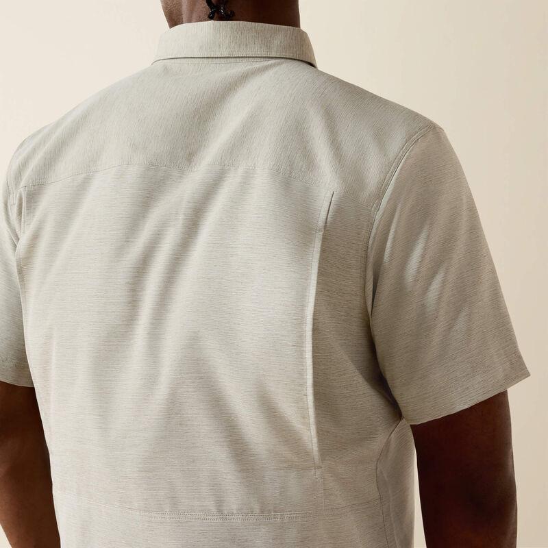 Light-colored, short-sleeve shirt.