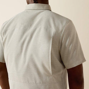 Light-colored, short-sleeve shirt.