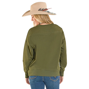 Person wearing an olive green sweatshirt and blue jeans with a beige hat on a white background