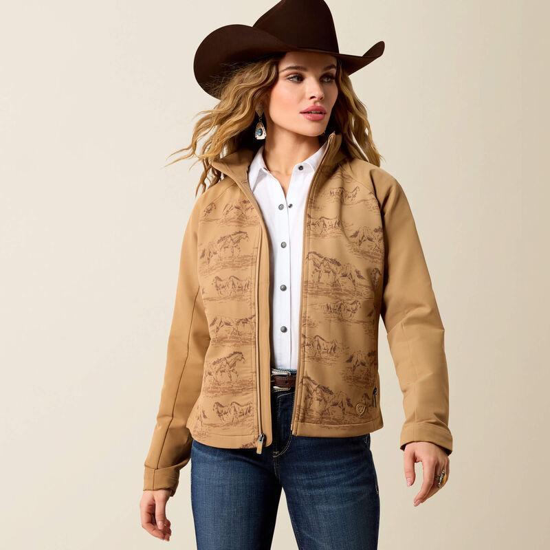 A woman wearing a tan western-style zip-front jacket with a brown horse-print pattern.