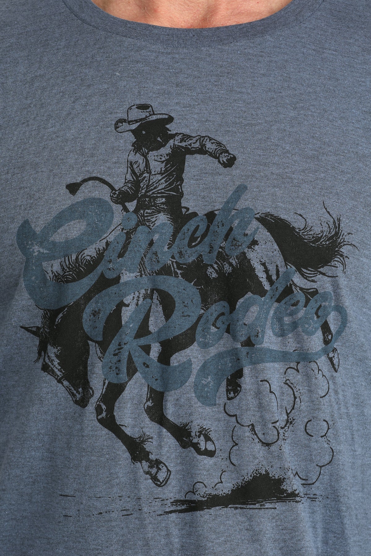 BLUE t-shirt with a graphic of a cowboy riding a horse and the text 'Cowboy Rides'.