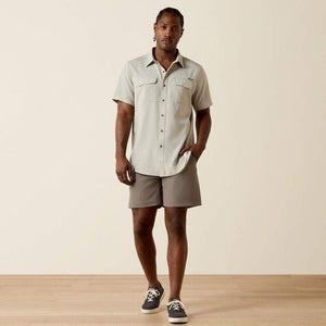 Light-colored, short-sleeve shirt.