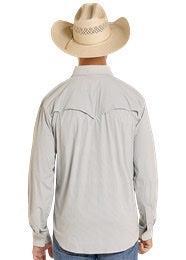 Person wearing a light gray long-sleeve shirt and cowboy hat, standing against a plain background