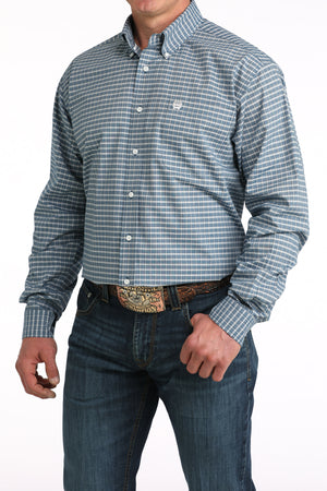 Man wearing a blue checkered shirt and jeans on a white background
