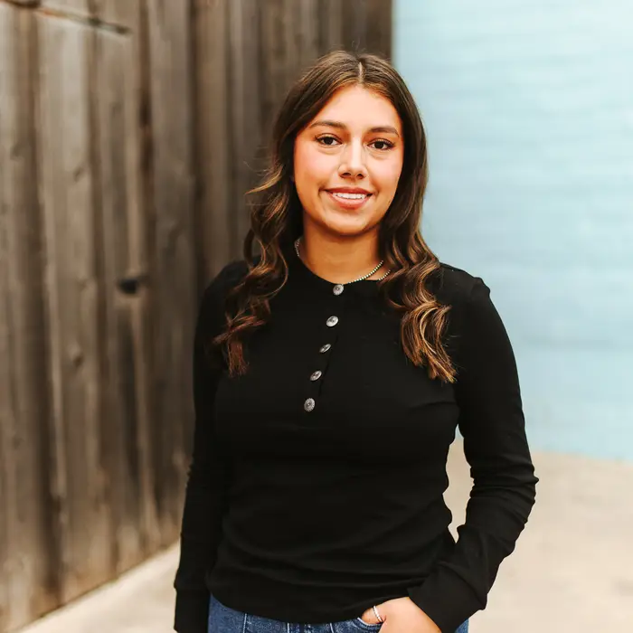 Versatile black long-sleeve shirt with a quarter button-down.
