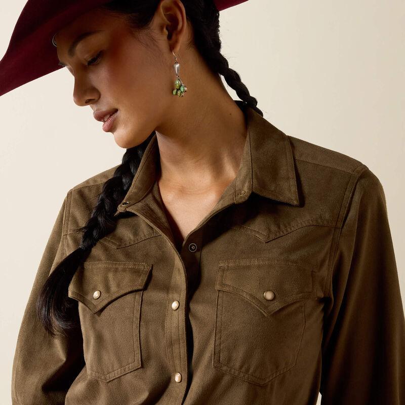 A woman modeling aolive green long-sleeve button-up shirt with two chest pockets.