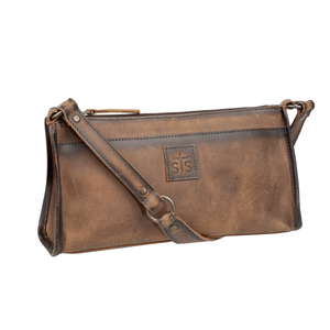 Brown leather bag with a strap on a white background