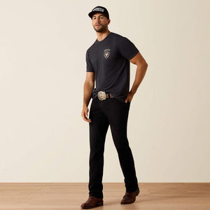 Man wearing a black t-shirt with 'Ariat Boots' logo on the back