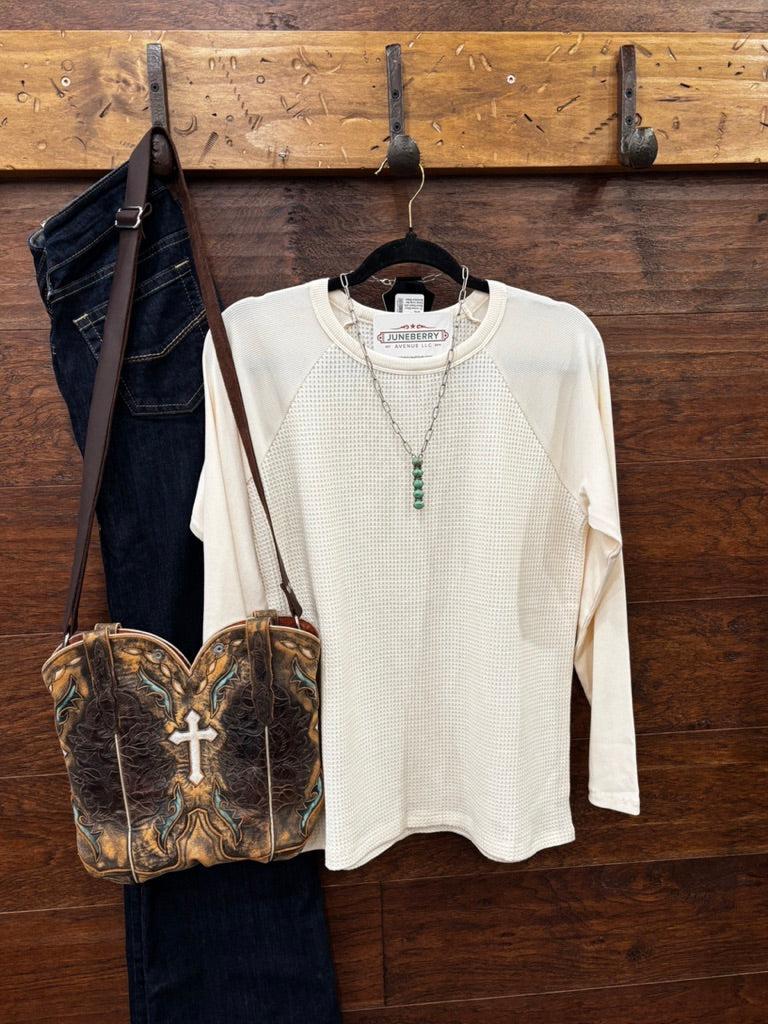 An off-white waffle-knit raglan long-sleeve shirt 